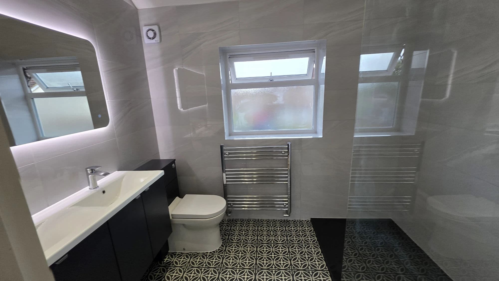 Ingleby Barwick Premium Bathroom Installation with Walk-In Shower and Double Vanity in Ingleby Barwick — after completion. Services: Shower Installation, Plumbing, Bathroom Tiling, Flooring, Bathroom Installation, Bathroom Refurbishment, Shower Room, Lighting, Bathroom Renovation.